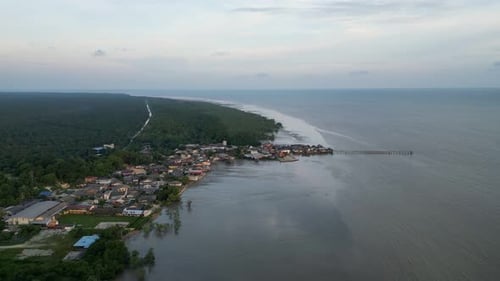 A town is located on the shore. Aerial sunset Segenting, Batu Pahat.