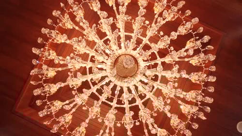 Beautiful Antique Crystal Chandelier under Wood Ceiling