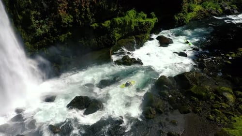 Aerial view of whitewater kayaker running class IV rapids on the Mill Creek section of the Rogue Riv