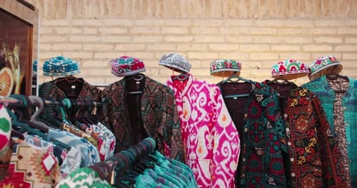 Khiva Uzbekistan Fortress Ichan Kala bright clothes oriental style. Street vendors in Khiva 1