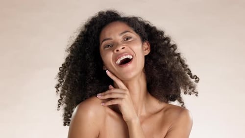 Beauty, skincare and laugh with black woman in studio for cosmetics, satisfaction and self love