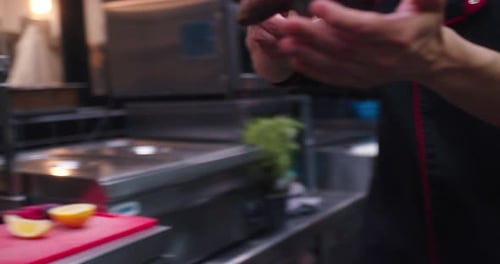 Chef Plates Steak Dinner in Restaurant Kitchen