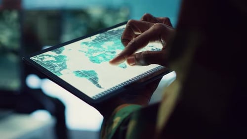 Tablet World Map Interface in Office Environment