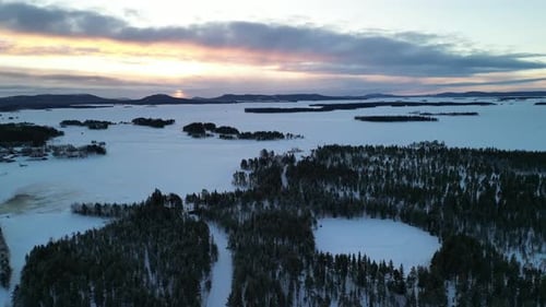 Aerial view of winter landscapes with snow-covered forest in Finland