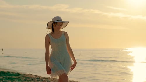 Happy Cheerful Woman Dancing and Spinning on Sandy Beach at Sunset Attractive Brunette Girl on Ocean