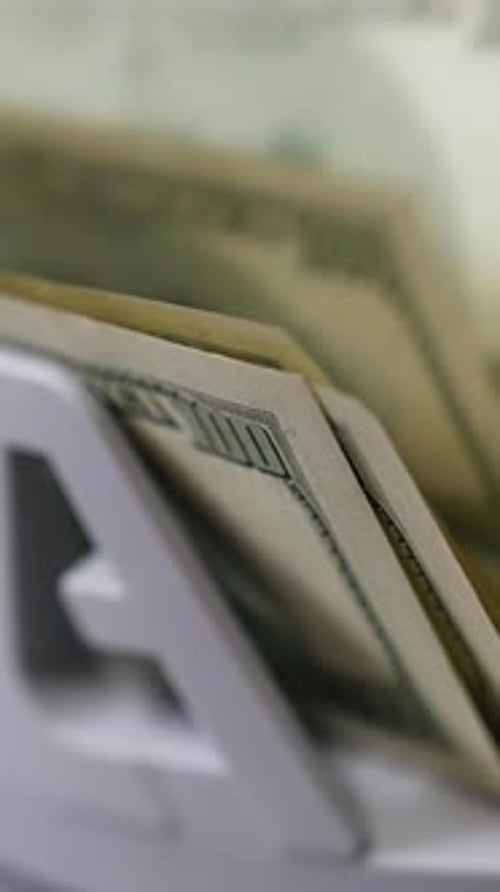 Money counting machine. Banknote counter are counting hundred dollar bills.