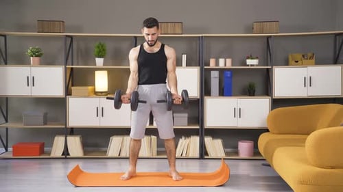 Man Working Out at Home with Weights