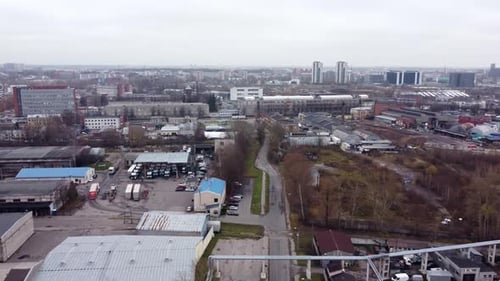 Drone fly Industrial port town of Andrejsala in Latvia, Riga, over foggy skyline landscape