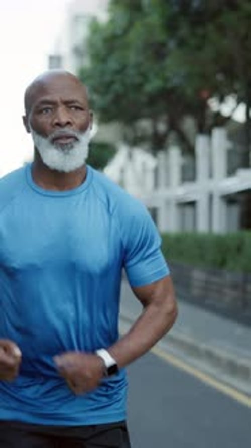 Fitness, active or old man in city with running, cardio or stamina exercise in physical activity