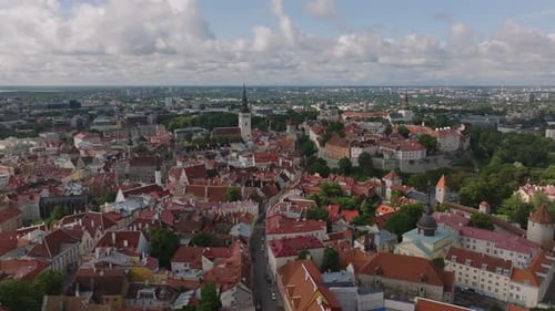 Fly Above Old Town with Historic Houses and Narrow Curvy Aisles Churches with Tall Towers Tallinn