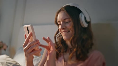 Happy Girl Searching Song Playlist in Smartphone Closeup Energetic Woman Dance