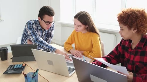 Diverse Team Working Together on Project in Modern Office