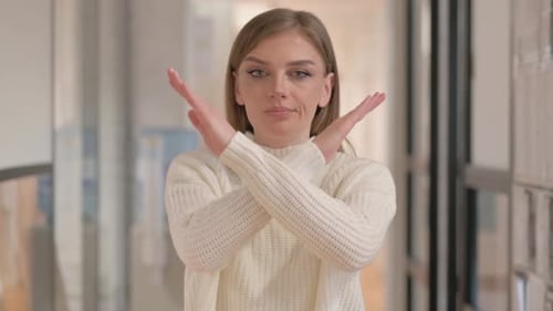 Woman Making a No Gesture with Crossed Arms