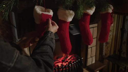 Festive Christmas Stockings Hanging on Mantle by Fireplace