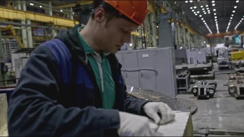 Worker at Factory Makes Measurements of Structure Stock Clip Worker in Hard Hat Measures Parts of