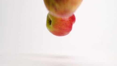 Apples Bouncing on White Background