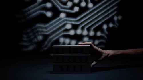 Black Friday Sale Illuminated Box with Technology Background