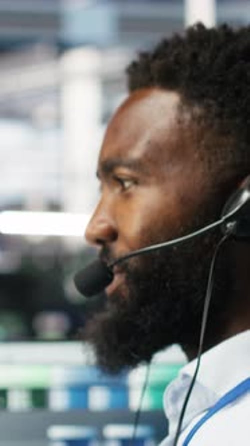 Vertical Video Data Center Employee Talking in Headset Mic Coordinating Technicians