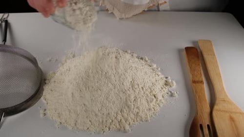 Pouring Flour on Bench