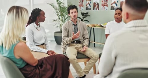 People, group therapy and man in circle at meeting with listening, advice and empathy with kindness