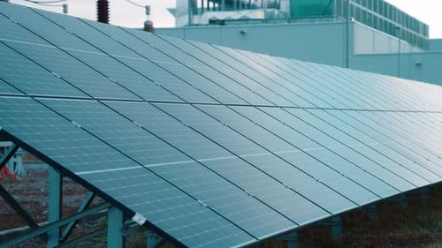 Blue Solar Panels Power Plant on Bright Day