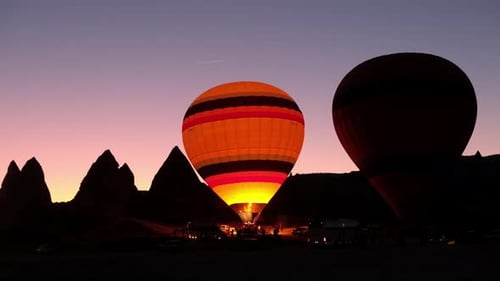 Hot Air Balloons Inflating at Sunrise
