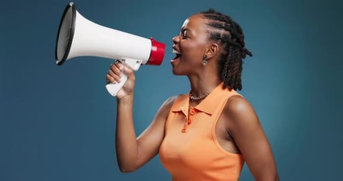 Megaphone, shouting and black woman in studio with news for announcement, information and speech