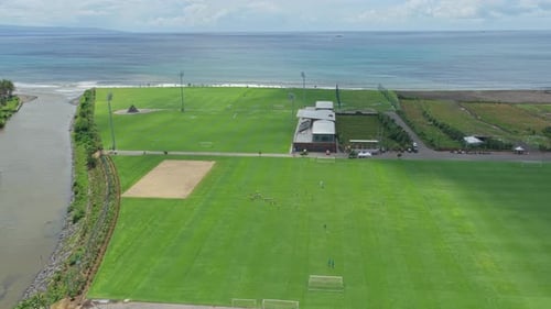 Aerial view of bali united soccer training center by the ocean