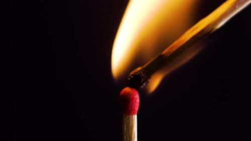 Igniting Match Flames Brightly in the Dark