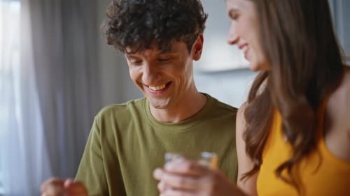 Young Adult Couple Enjoys Coffee Together at Home