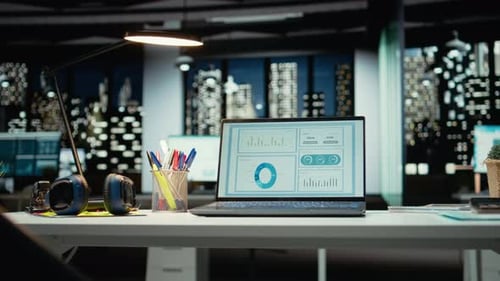 Empty Corporate Boardroom at Night with Digital Display of Performance Metrics