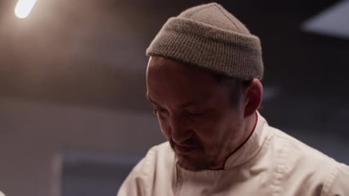 Male Chef Working in Kitchen of Restaurant