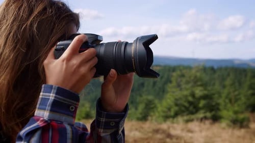 Female Photographer Taking Pictures Of Green Landscape At Summer. Happy Woman Using Photo Camera ...