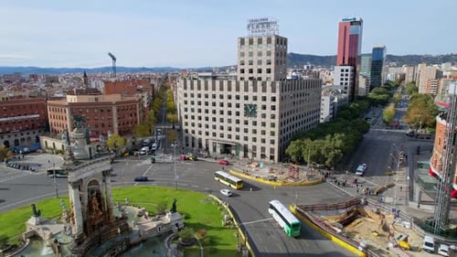 Aerial view of busy street traffic at roundabout at Plaza de Espana of Squares is one of Barcelona