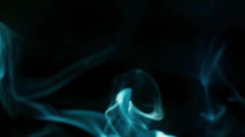 Abstract Blue Smoke Flowing on Black Background