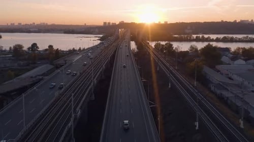 Evening Cityscape with Highway Bridge Over the River
