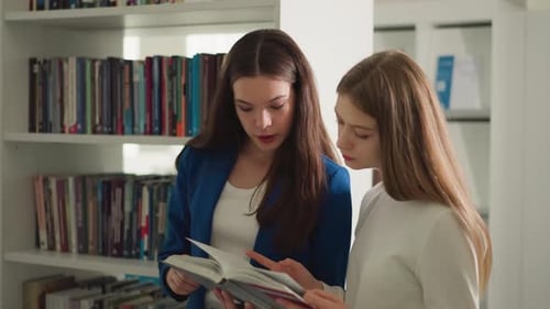 Ladies Students Read Novel Together in Library