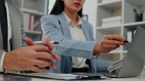 Business Team Collaborating on Project in Modern Office