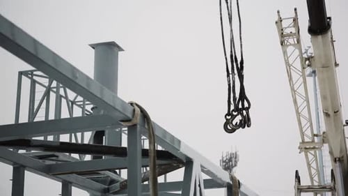Crane Lifting Steel Beam for Building Construction