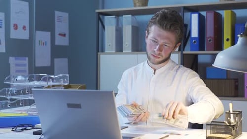 Counting money, thinking.