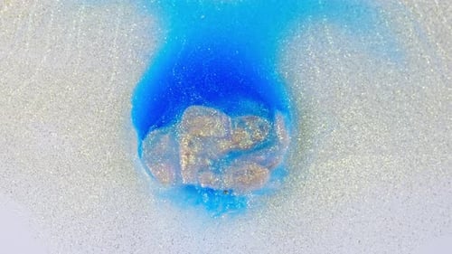 Blue and purple ink merging in water, creating an abstract cloud, top view, studio lighting