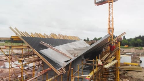 Elevating Aerial View Showcasing Construction Workers in Safety Gear Vigorously Contributing to the