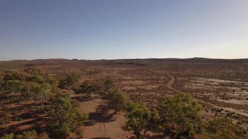 A flyover of a dry billabong in central Australia.