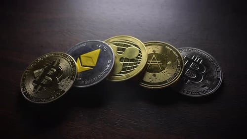 Assorted Cryptocurrency Coins on a Brown Surface