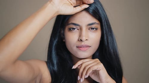 Portrait of Beautiful Young Woman with Long Hair