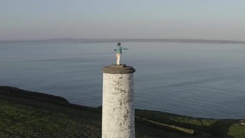Retreating aerial of Metal Man monument beacon tower, Tramore IRL