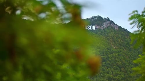 Name of the city on the hill with greenery in Brasov, Romania