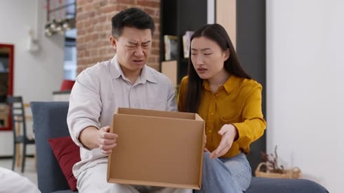 Couple Reacts Negatively to Contents of Box