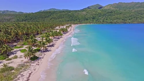 Empty coastline with white sand beach, turquoise water, drone in the Caribbean