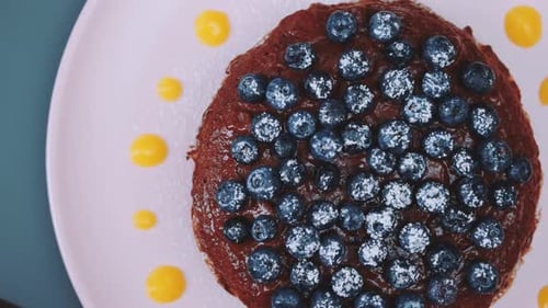 Chocolate Pancake Cake with Blueberries and Powdered Sugar